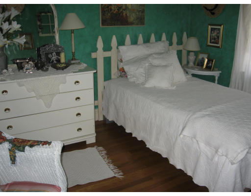 42 Sheldon Road Newton, MA 02459 - Photo 8 of 9 a bedroom with a bed and a potted plant