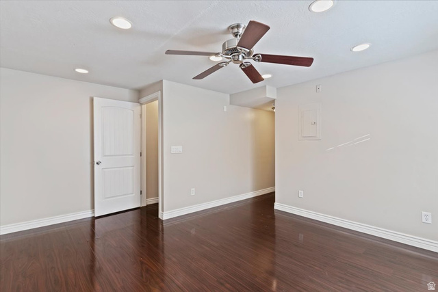 2350 South Highway 89, Unit 4 Perry, UT 84302 - Photo 7 of 30 Spare room with ceiling fan, dark wood-type flooring, electric panel, and recessed lighting