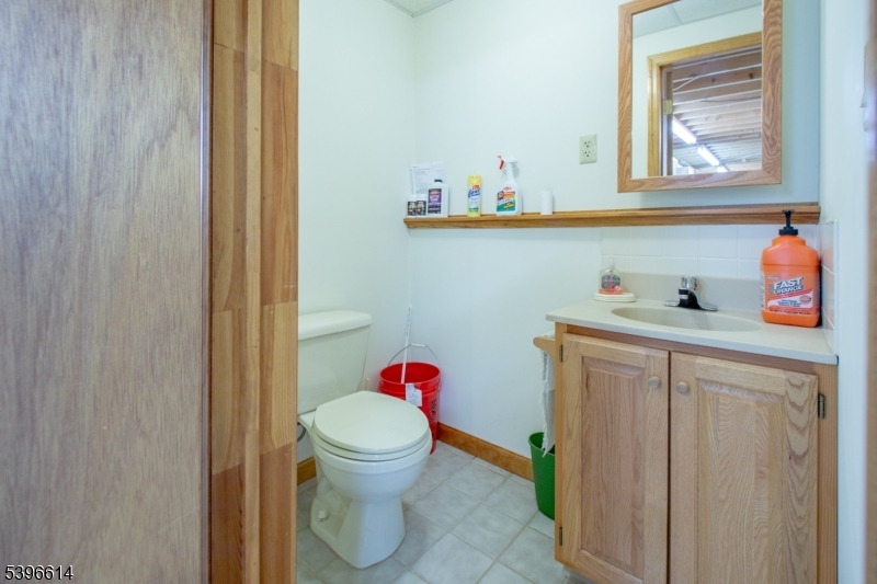 171 Mt Salem Road Wantage, NJ 07461 - Photo 25 of 38 a bathroom with a toilet sink and mirror
