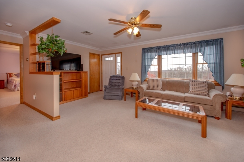 171 Mt Salem Road Wantage, NJ 07461 - Photo 4 of 38 a living room with furniture a chandelier and a pool table
