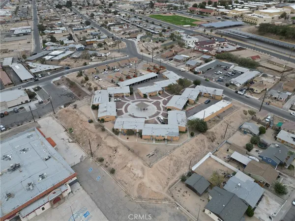 an aerial view of residential houses with outdoor space