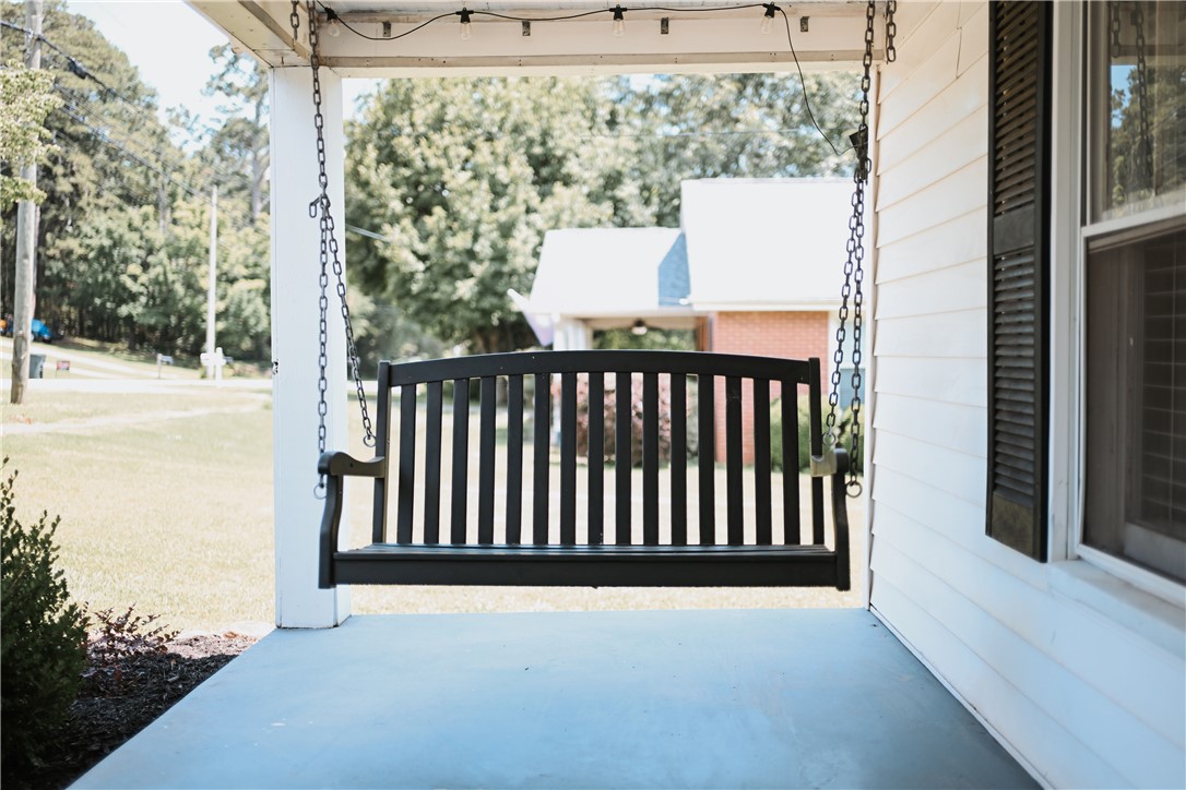 310 North Chestnut Street Seneca, SC 29678 - Photo 4 of 30 A classic porch swing invites relaxation on this welcoming front porch.