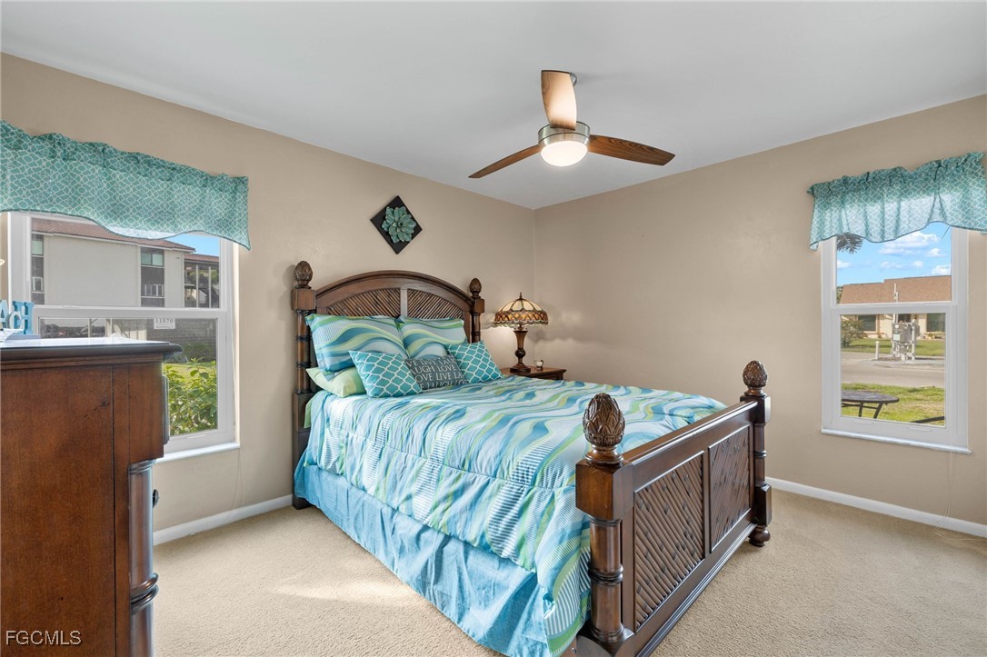 11545 Cinnamon Cove Boulevard Fort Myers, FL 33908 - Photo 20 of 26 a bedroom with two beds and window