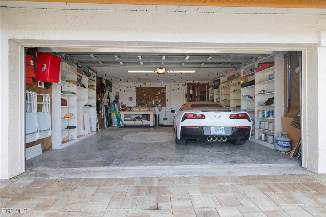 11545 Cinnamon Cove Boulevard Fort Myers, FL 33908 - Photo 24 of 26 a car parking in front of a building