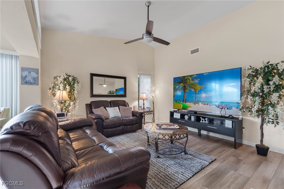 11545 Cinnamon Cove Boulevard Fort Myers, FL 33908 - Photo 6 of 26 a living room with furniture and a flat screen tv