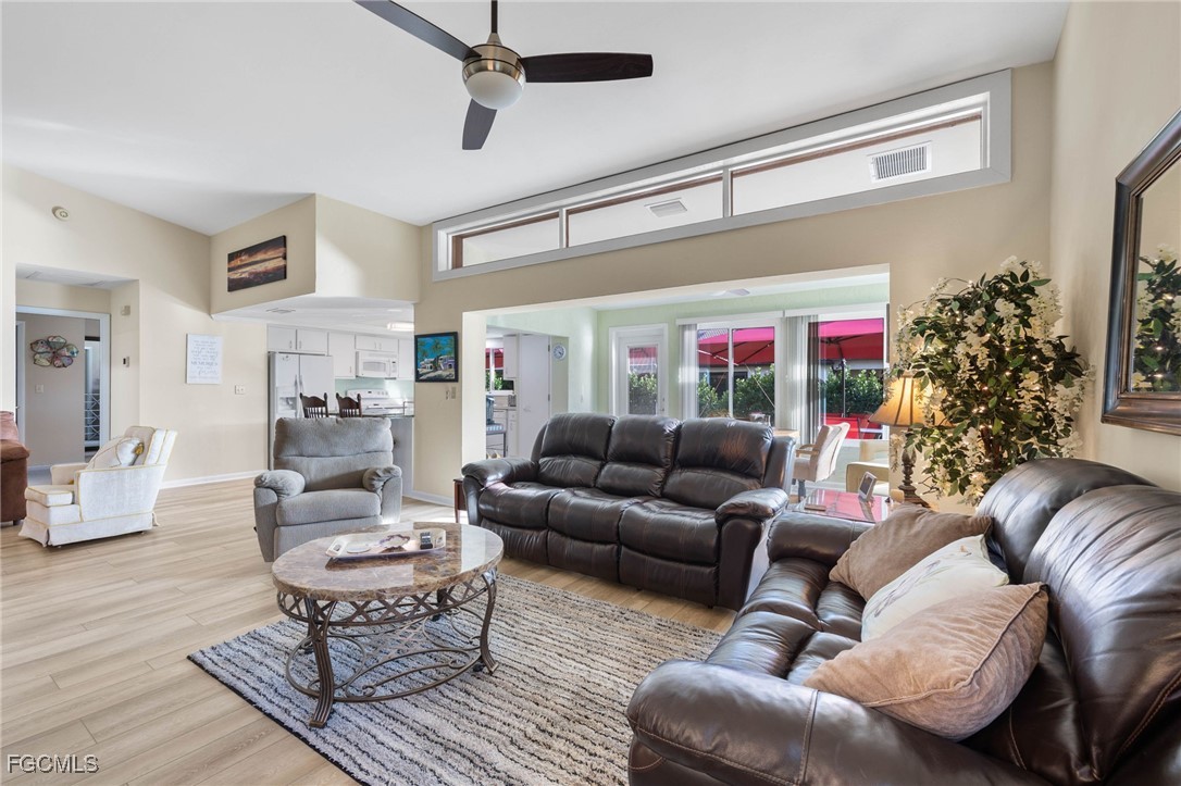 11545 Cinnamon Cove Boulevard Fort Myers, FL 33908 - Photo 7 of 26 a living room with furniture and a potted plant