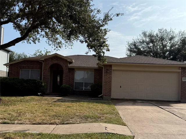 a view of house with yard