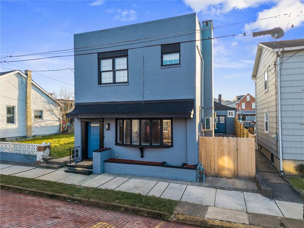 309 Beech Street Vandergrift, PA 15690 - Photo 2 of 47 a front view of a house with a yard