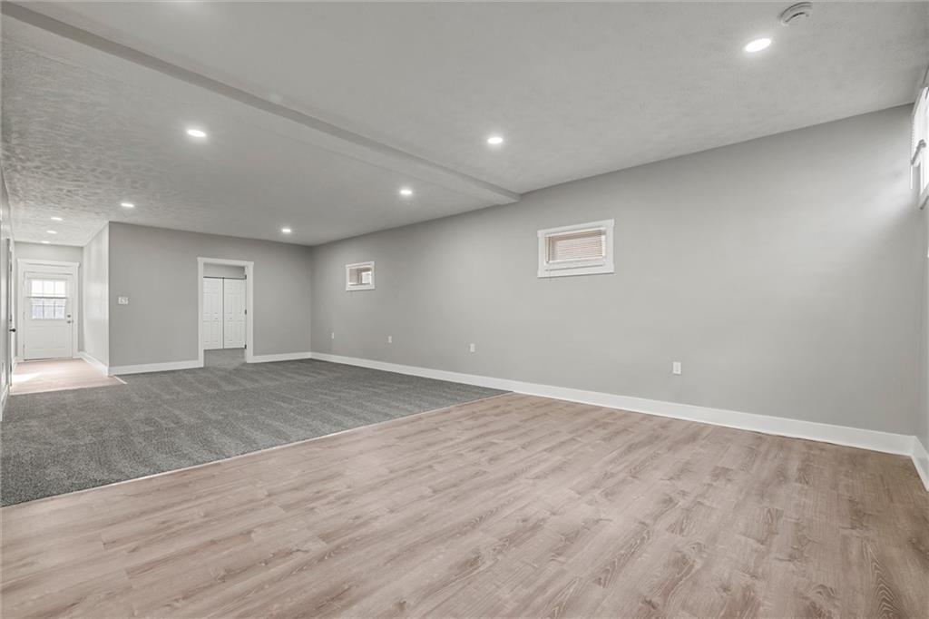 309 Beech Street Vandergrift, PA 15690 - Photo 30 of 47 an empty room with wooden floor and window