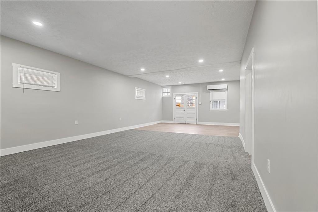 309 Beech Street Vandergrift, PA 15690 - Photo 32 of 47 an empty room with windows and entrance