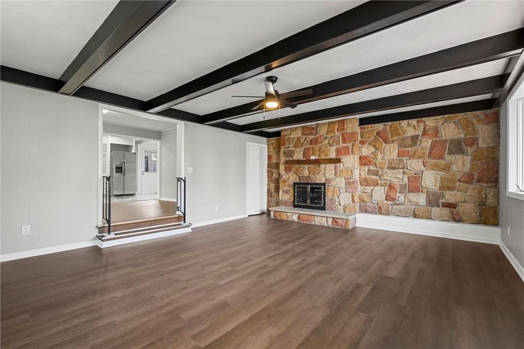 309 Beech Street Vandergrift, PA 15690 - Photo 4 of 47 a view of empty room with wooden floor and fireplace