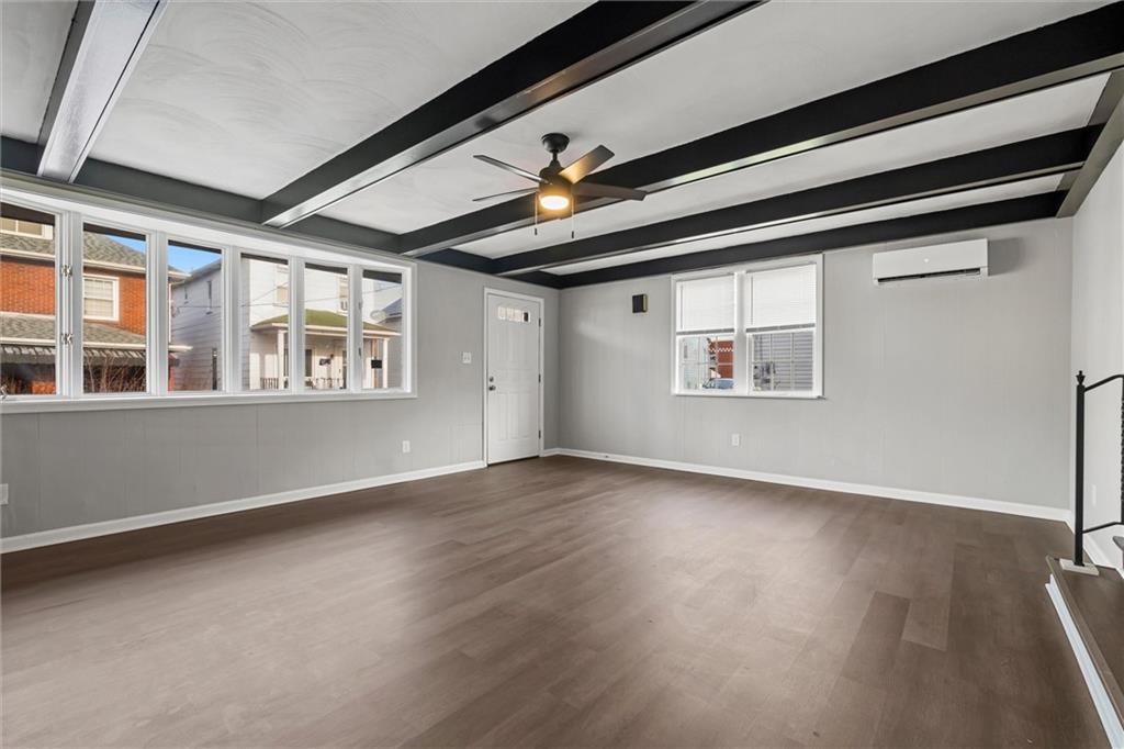 309 Beech Street Vandergrift, PA 15690 - Photo 5 of 47 a view of empty room with wooden floor and fan
