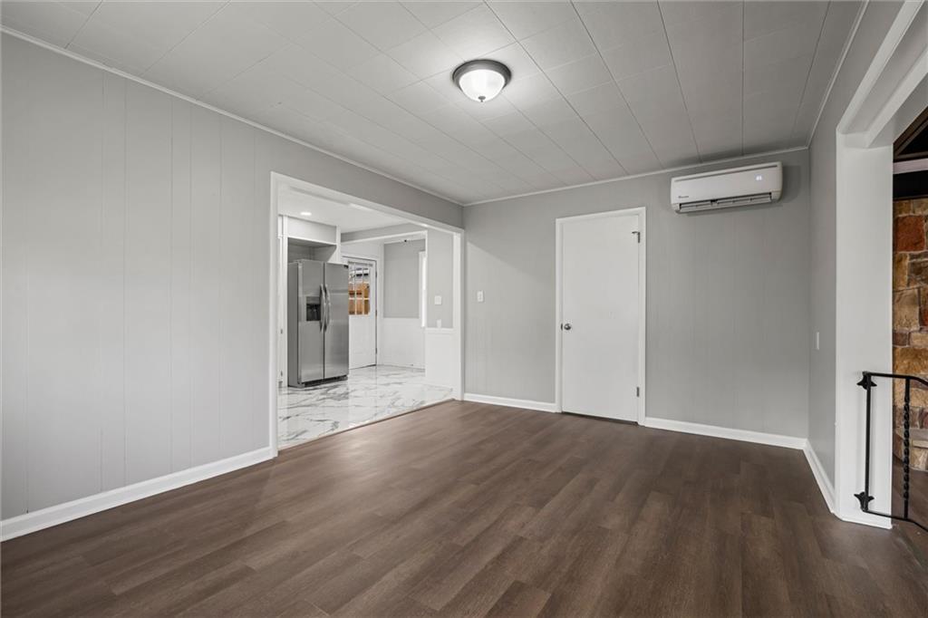 309 Beech Street Vandergrift, PA 15690 - Photo 6 of 47 wooden floor in an empty room with a window