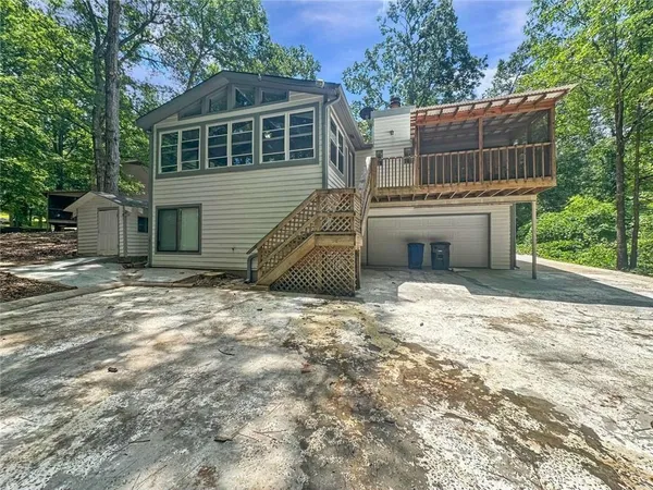 a backyard of a house with a yard and garage