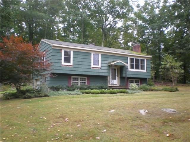 88 Stony Hill Road Ridgefield, CT 06877 - Photo 1 of 1 a front view of a house with a garden