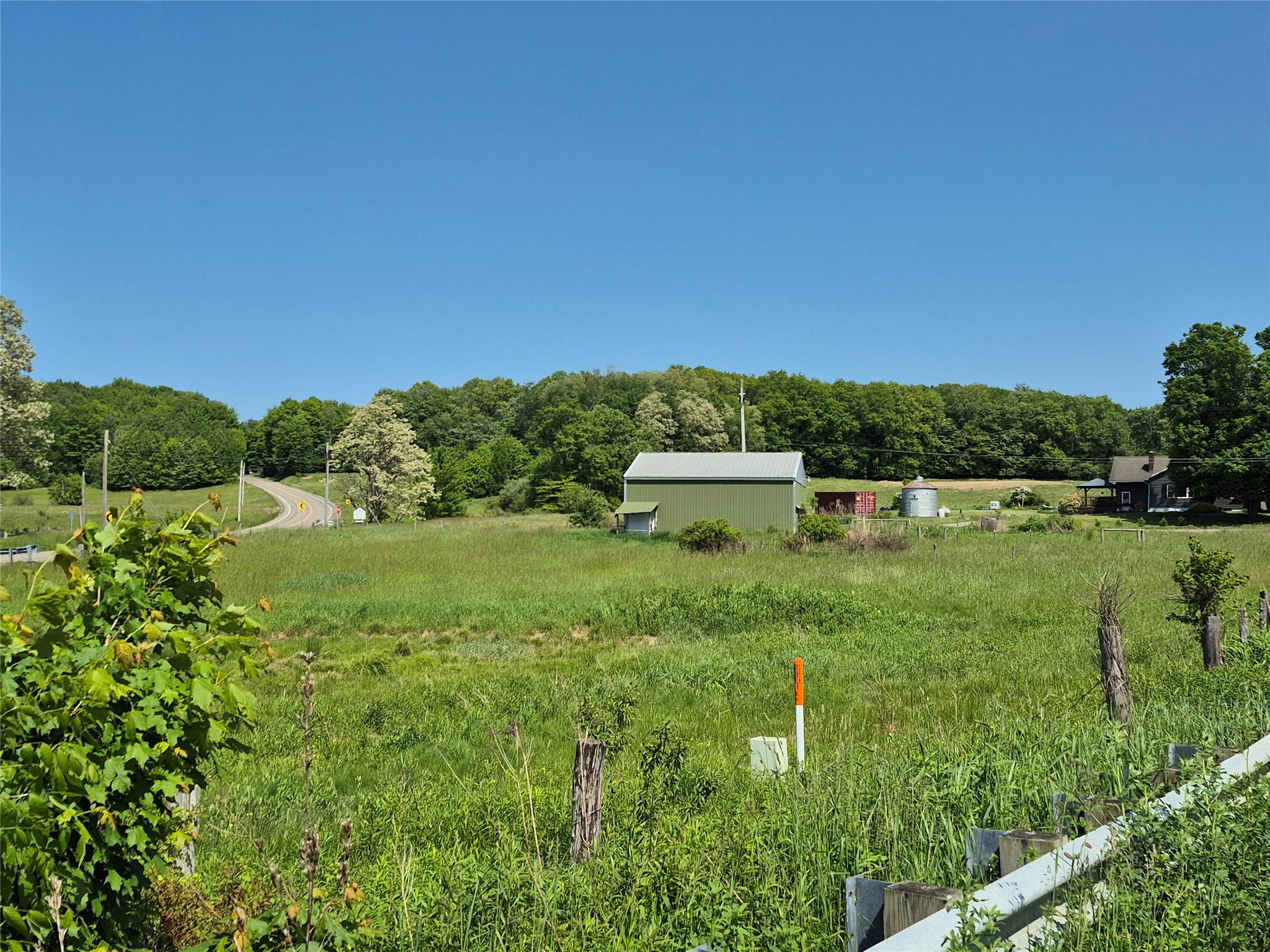 11120 W Road Albion, PA 16401 - Photo 2 of 19 a view of a lake with a house in the background