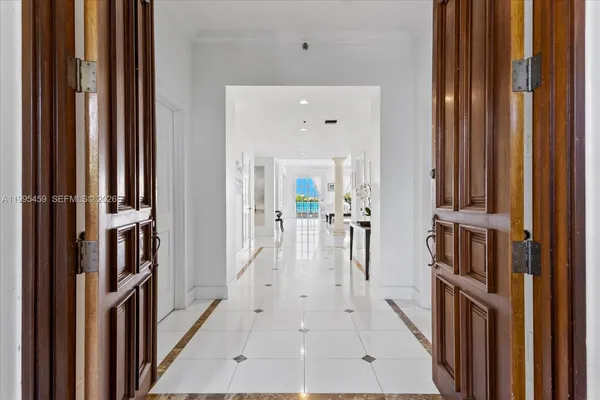 a view of a hallway with a living room