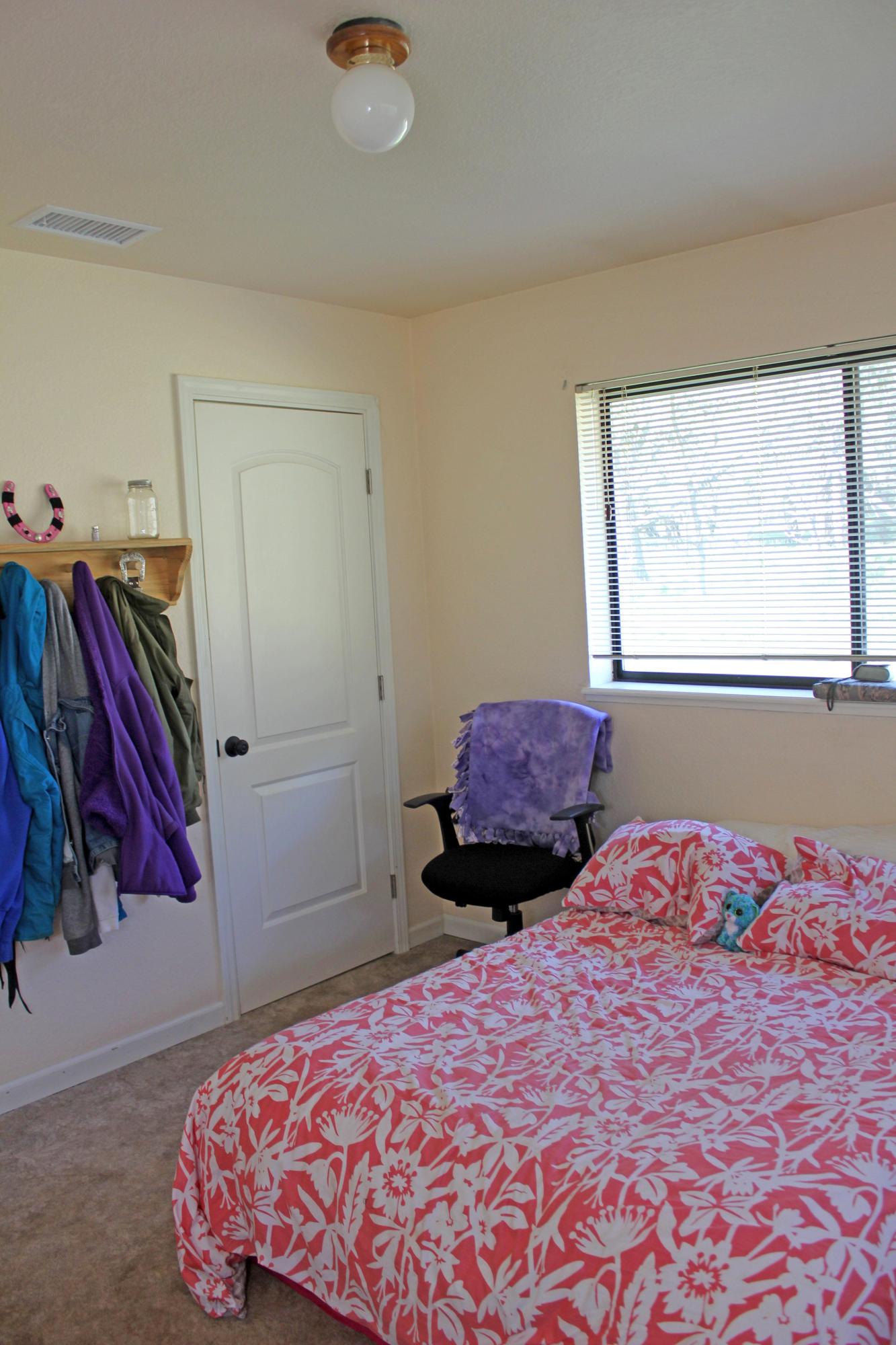 12499 Fern Road Whitmore, CA 96096 - Photo 24 of 27 a bedroom with a bed and a window