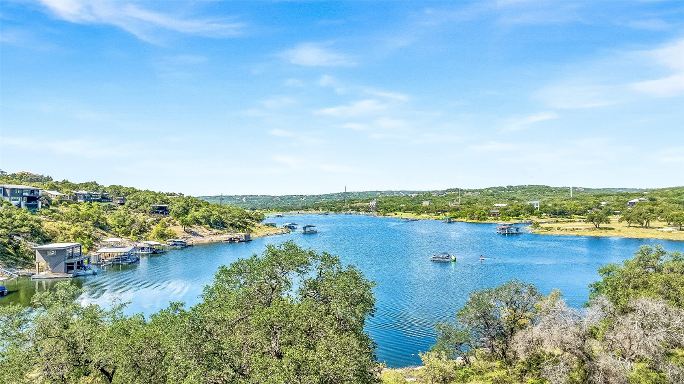 19815 Lakehurst Loop Spicewood, TX 78669 - Photo 15 of 21 a view of a lake with houses in the back