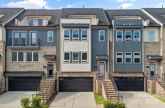 a front view of a house with a garage