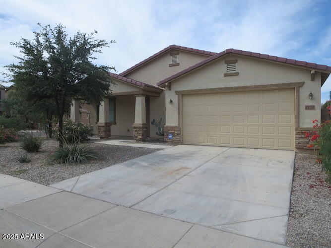 7120 South 68th Avenue Laveen, AZ 85339 - Photo 1 of 17 a view of a house with a yard and large tree