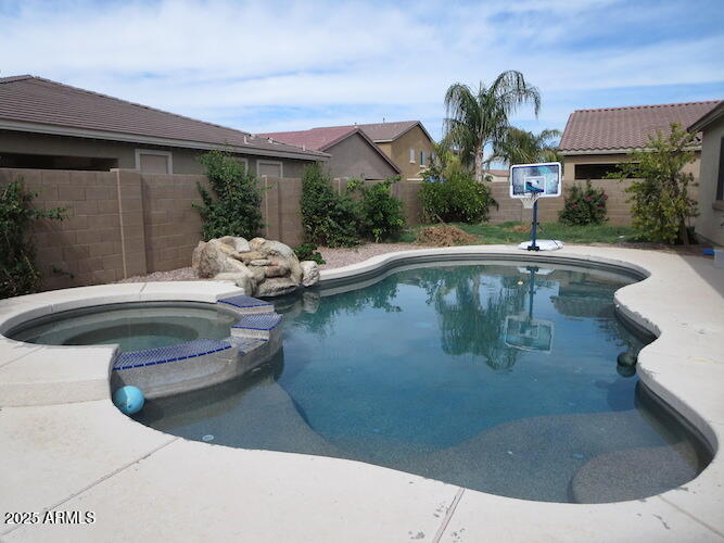 7120 South 68th Avenue Laveen, AZ 85339 - Photo 16 of 17 a swimming pool with outdoor seating and yard