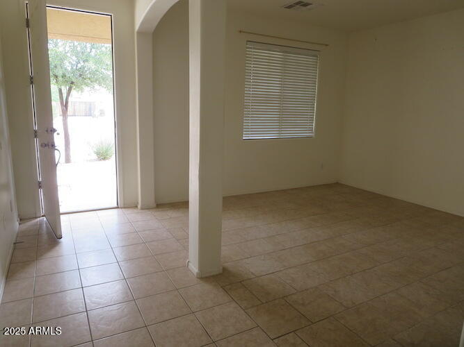 7120 South 68th Avenue Laveen, AZ 85339 - Photo 2 of 17 a view of an empty room with a window