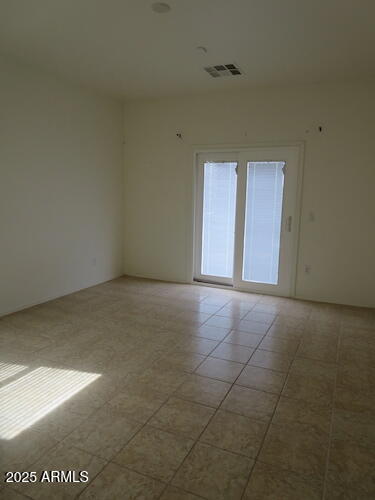 7120 South 68th Avenue Laveen, AZ 85339 - Photo 9 of 17 a view of an empty room with a window