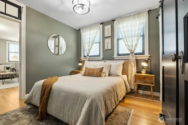 a bedroom with a bed and a chandelier