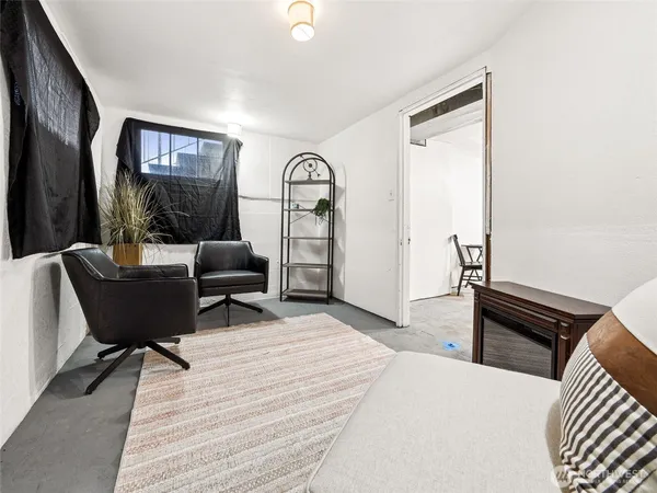 a view of a backyard with sitting area