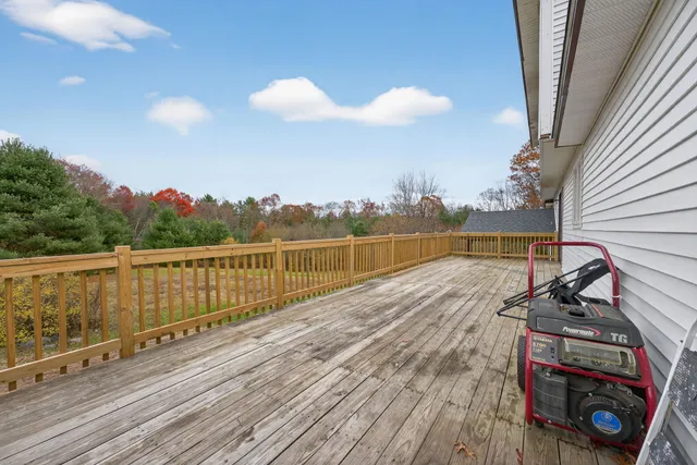 a view of a balcony with wooden floor