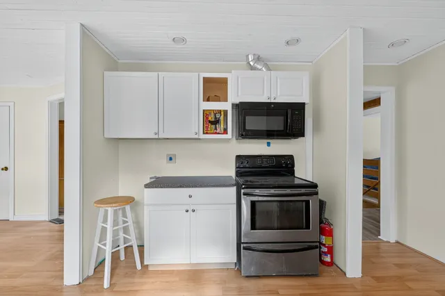 a kitchen with a stove and a microwave