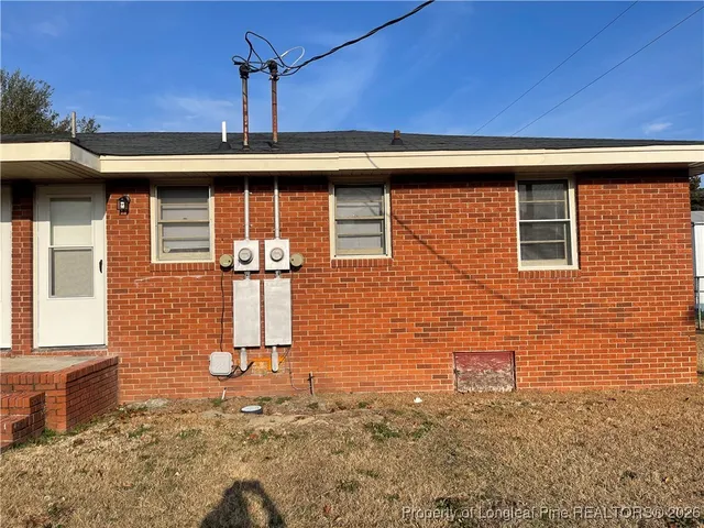 a front view of a house with parking
