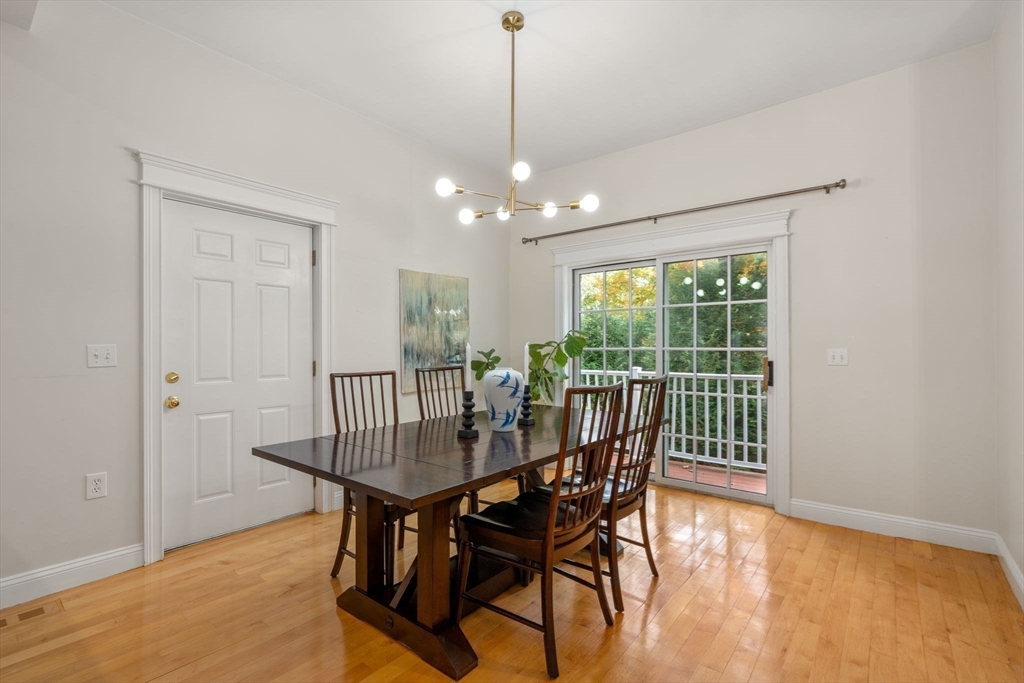 809 Boston Post Road, Unit B Weston, MA 02493 - Photo 14 of 39 a view of a dining room with furniture window and wooden floor