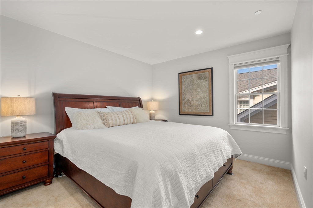 809 Boston Post Road, Unit B Weston, MA 02493 - Photo 19 of 39 a bedroom with a bed and a window