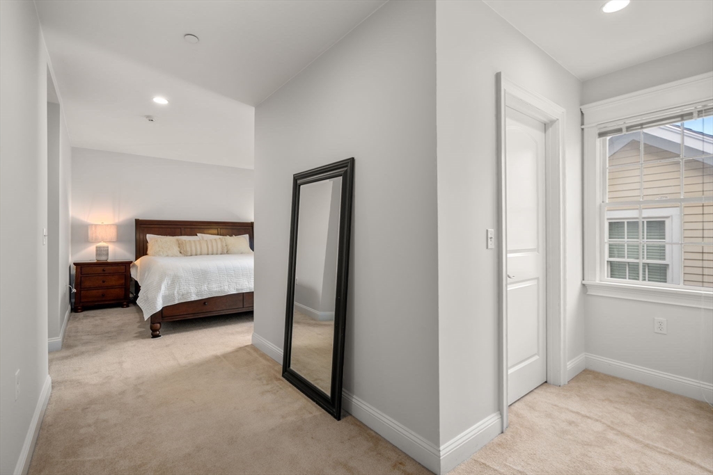 809 Boston Post Road, Unit B Weston, MA 02493 - Photo 20 of 39 a room with a bed and a large window