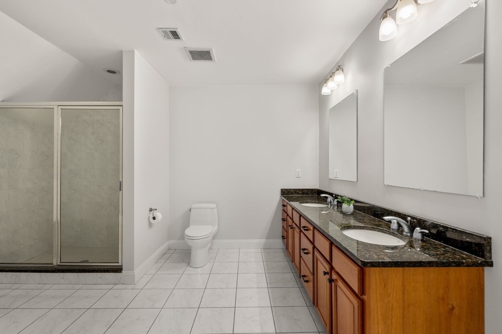 809 Boston Post Road, Unit B Weston, MA 02493 - Photo 23 of 39 a bathroom with a granite countertop sink and a mirror