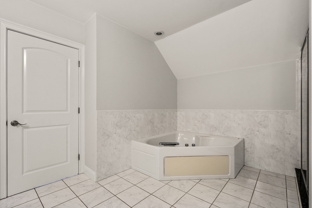 809 Boston Post Road, Unit B Weston, MA 02493 - Photo 24 of 39 a bathroom with a bathtub and sink