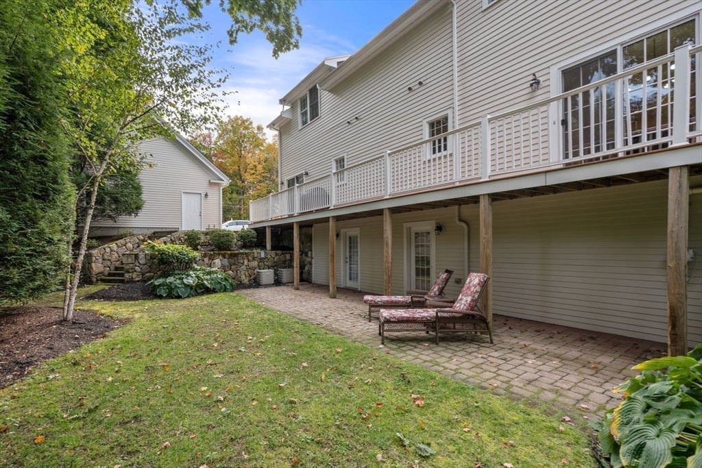 809 Boston Post Road, Unit B Weston, MA 02493 - Photo 36 of 39 a backyard of a house with a yard patio and outdoor seating