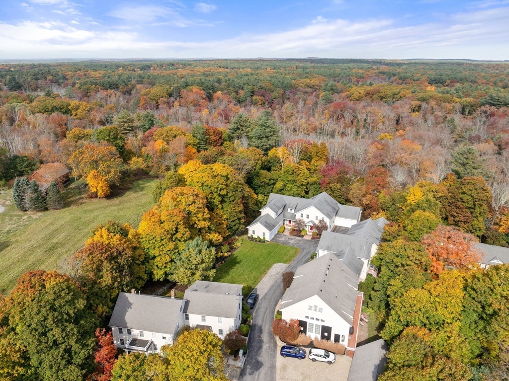 809 Boston Post Road, Unit B Weston, MA 02493 - Photo 4 of 39 an aerial view of residential houses with outdoor space