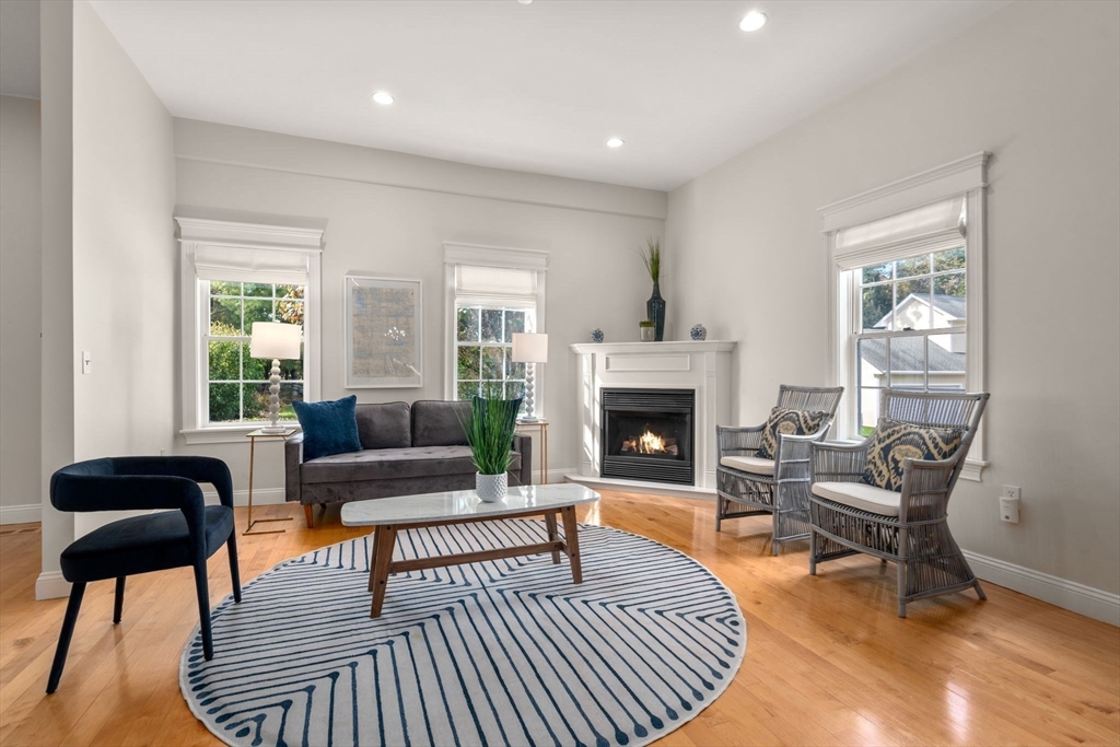 809 Boston Post Road, Unit B Weston, MA 02493 - Photo 8 of 39 a living room with furniture and a fireplace