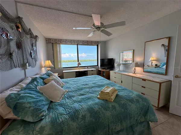 a bed room with furniture and window