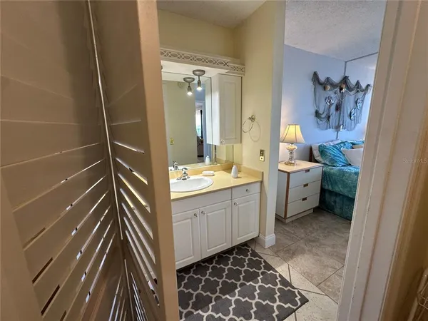 a bathroom with a double vanity sink mirror and toilet