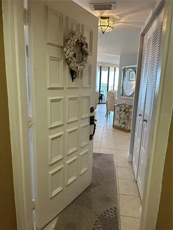 a view of a hallway to rooms and wooden floor