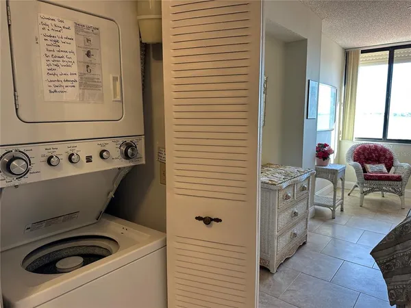 a bathroom with a sink and a washing machine