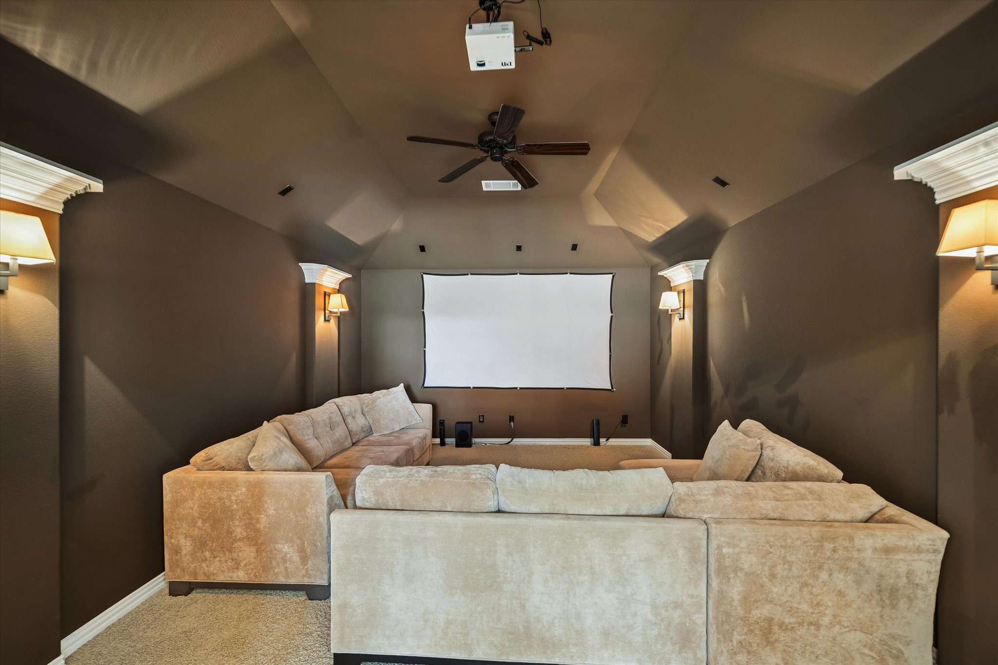 17403 Astrachan Road Richmond, TX 77407 - Photo 11 of 40 Cozy home theater room ideal for movie nights. Warm lighting and neutral tones create an inviting atmosphere.