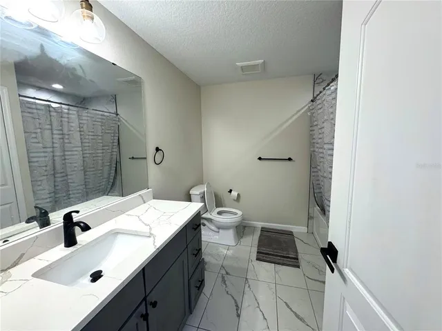 a view of house with backyard and entertaining space