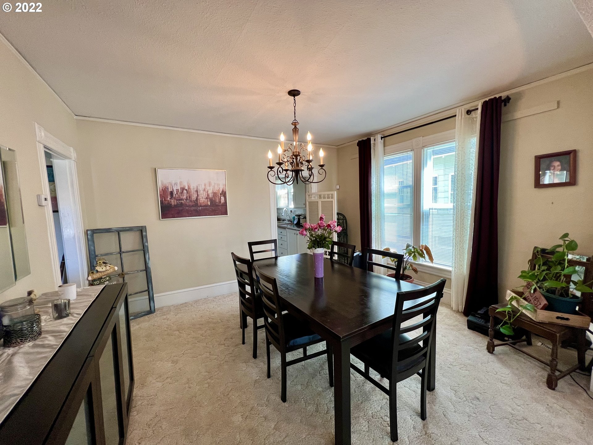 114 Southeast 7th Street Pendleton, OR 97801 - Photo 7 of 14 a view of a dining room with furniture and chandelier