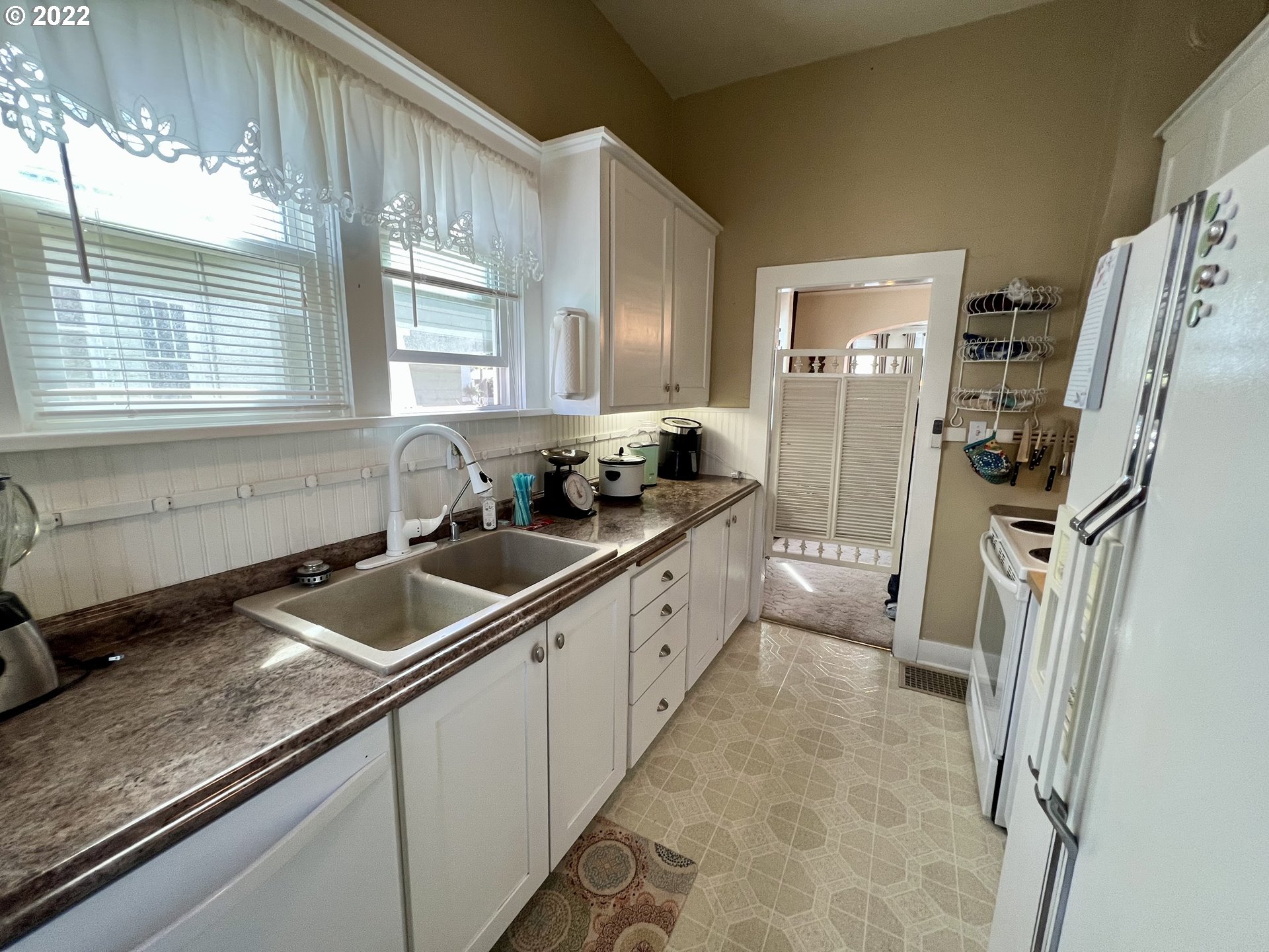 114 Southeast 7th Street Pendleton, OR 97801 - Photo 9 of 14 a kitchen with a sink a refrigerator and window