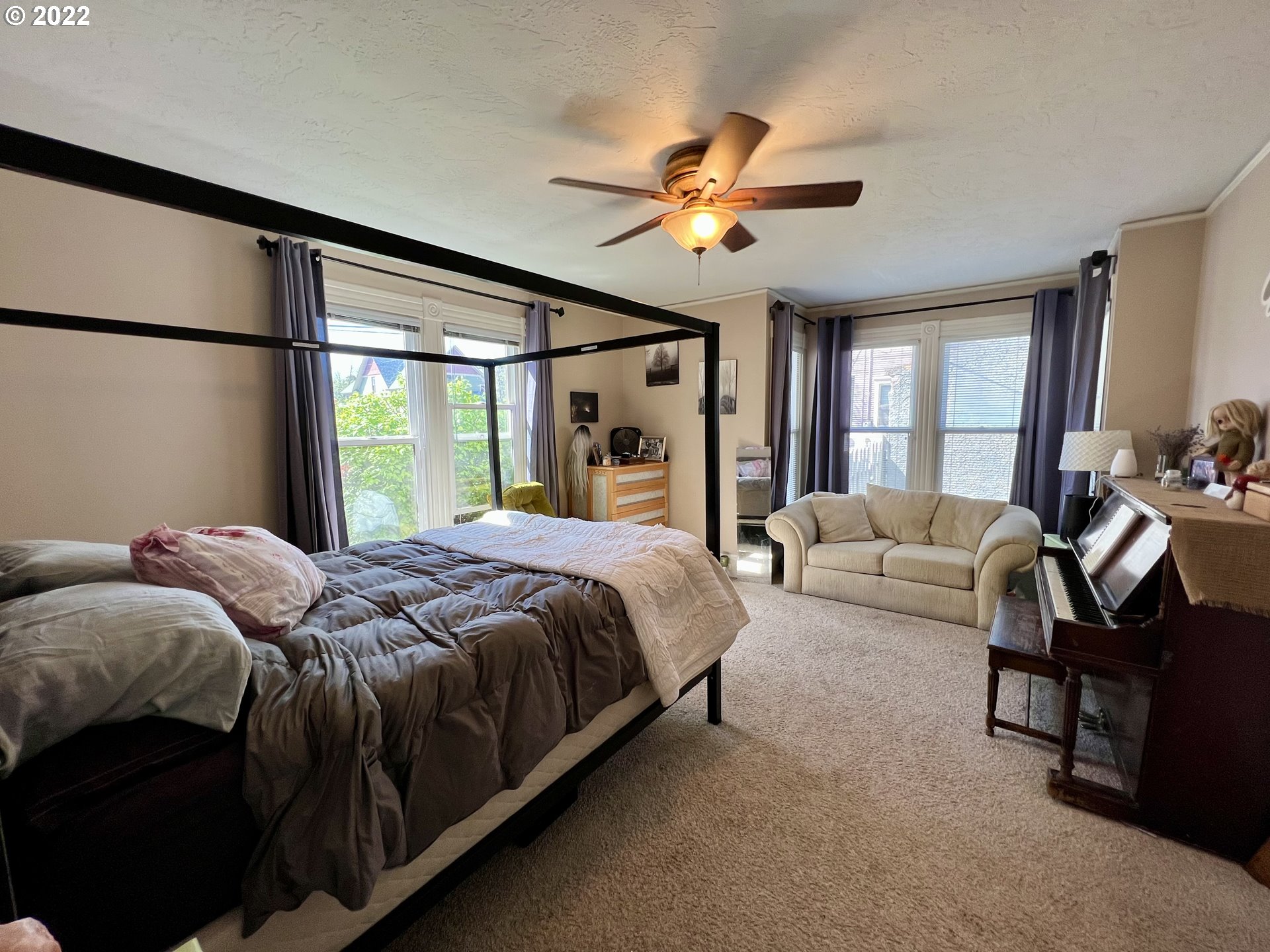 114 Southeast 7th Street Pendleton, OR 97801 - Photo 10 of 14 a bedroom with a bed couch and window
